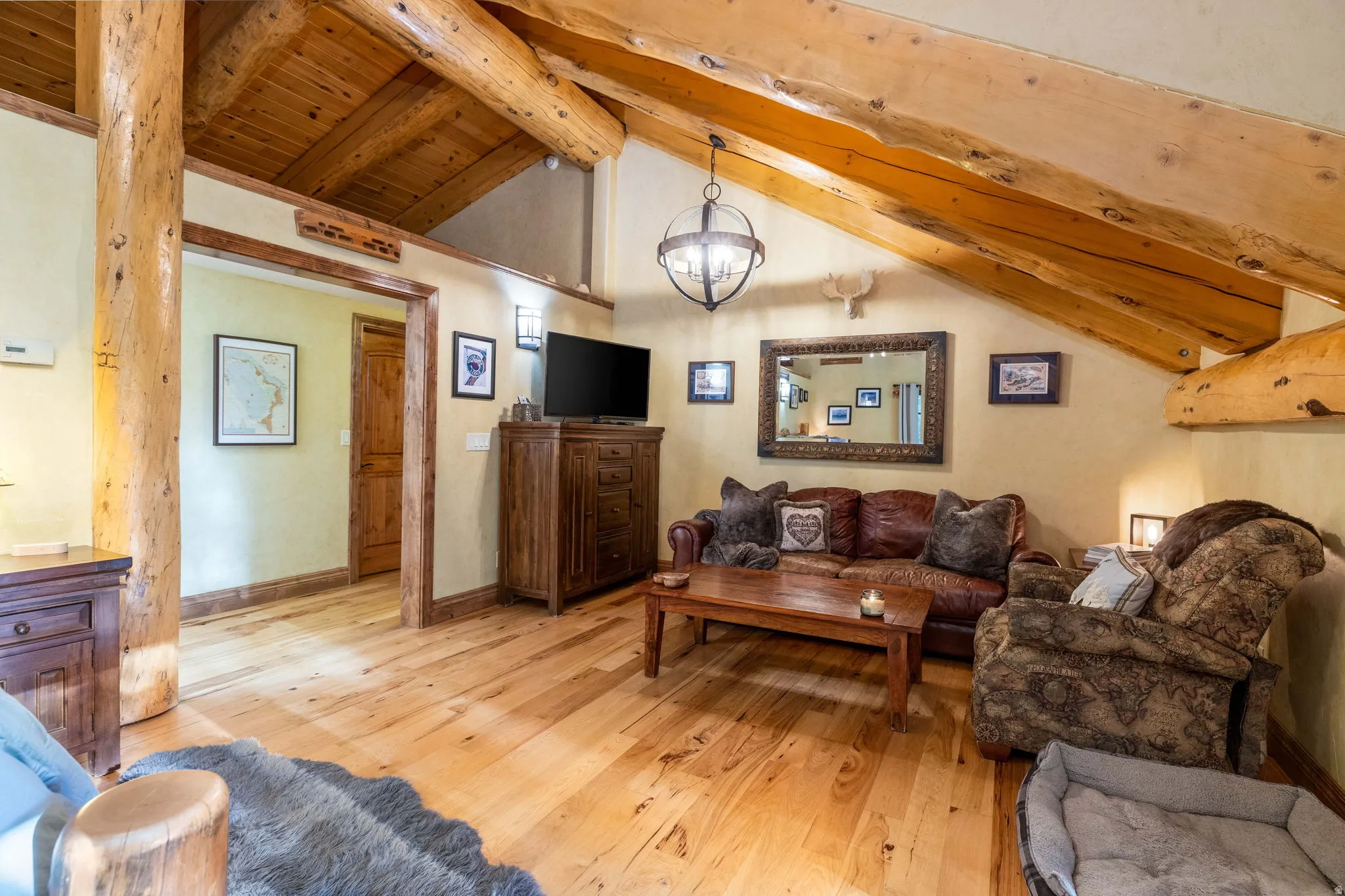 Vaulted wood-plank ceiling with exposed timber beams