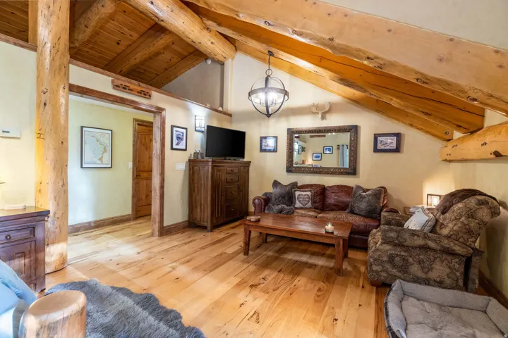 Vaulted wood-plank ceiling with exposed timber beams