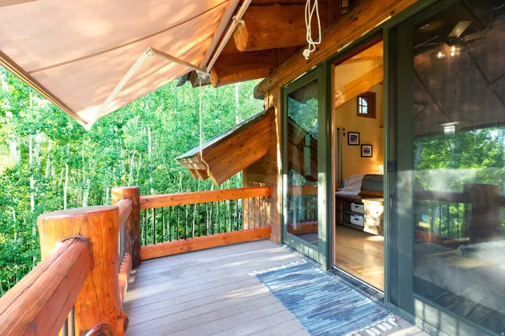 Outdoor deck with wood-finish decking and natural wood railings