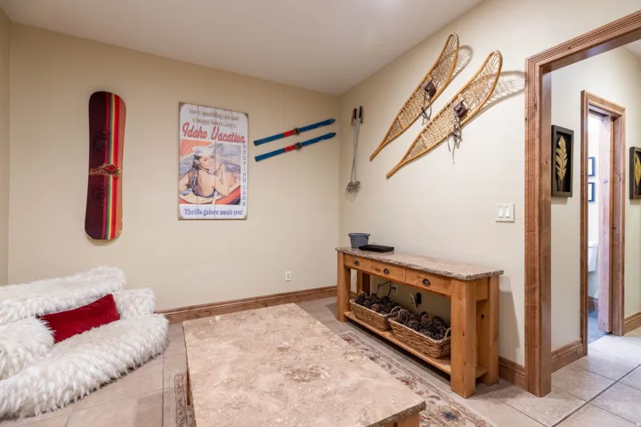Recessed lighting illuminates neutral walls and tile flooring
