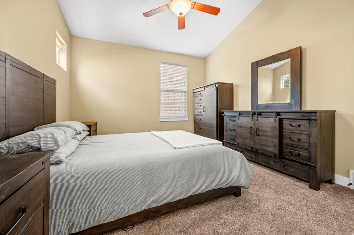 Spacious master bedroom featuring, neutral wall tones, and plush carpeting