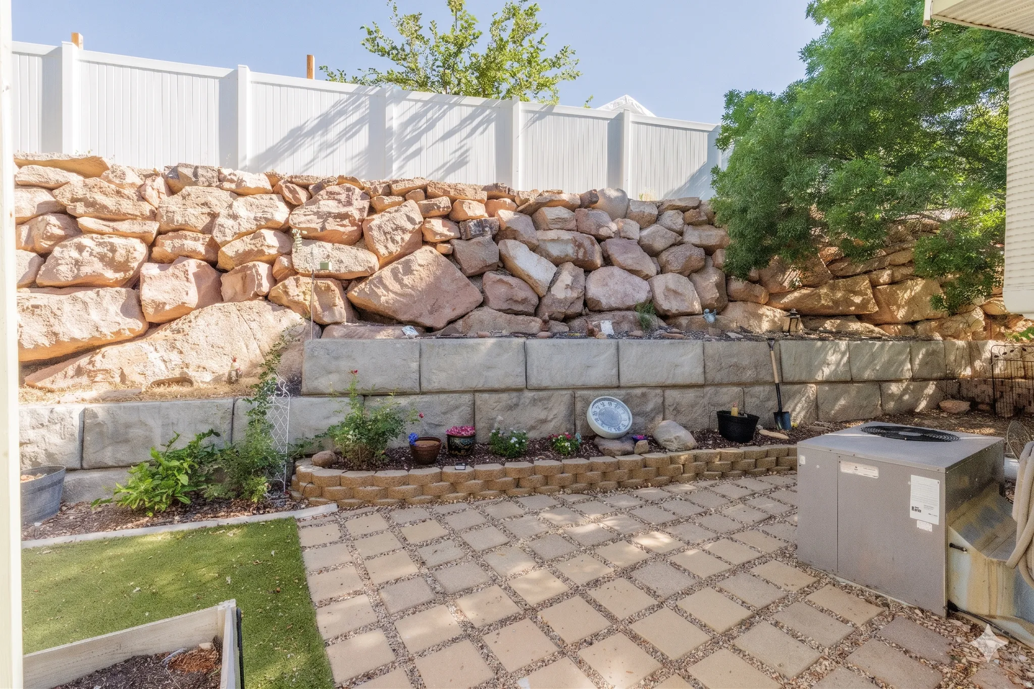 Private Fenced Backyard with Rock Wall