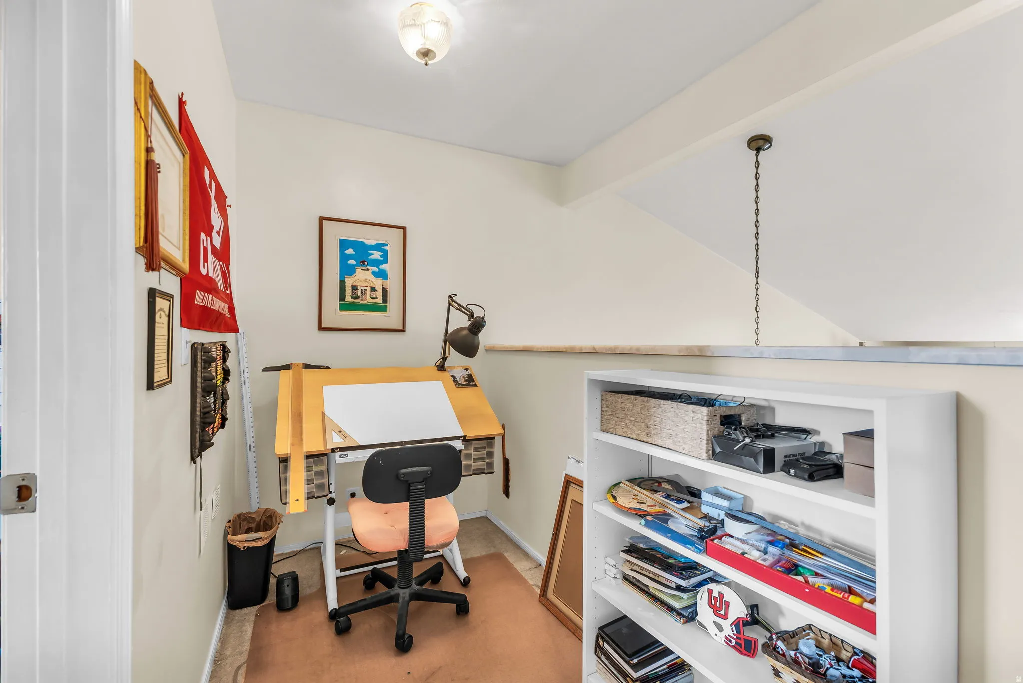 Dedicated alcove featuring a built-in workstation, neutral wall tones, and recessed ceiling lighting