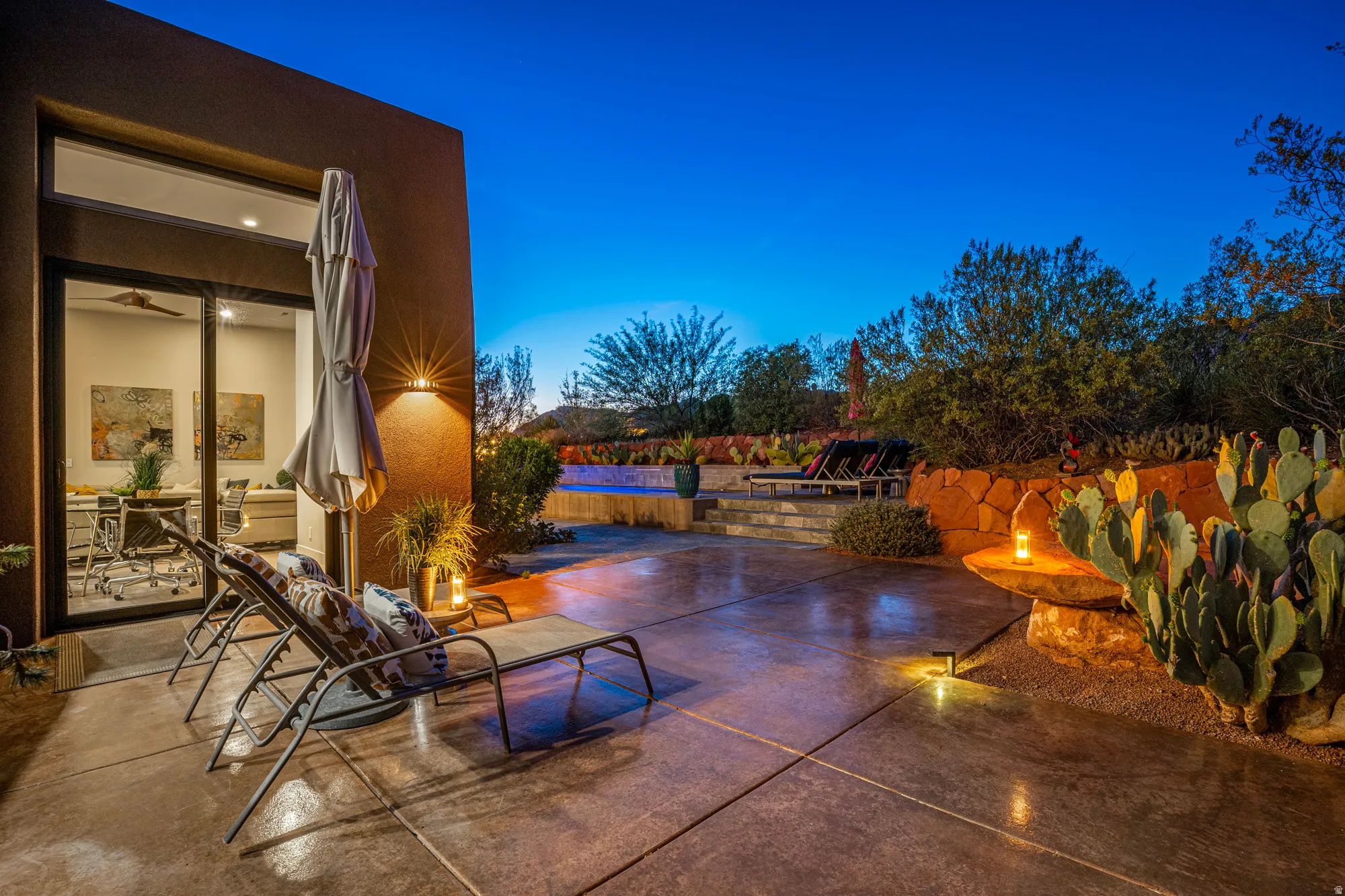 Expansive concrete patio with integrated lighting
