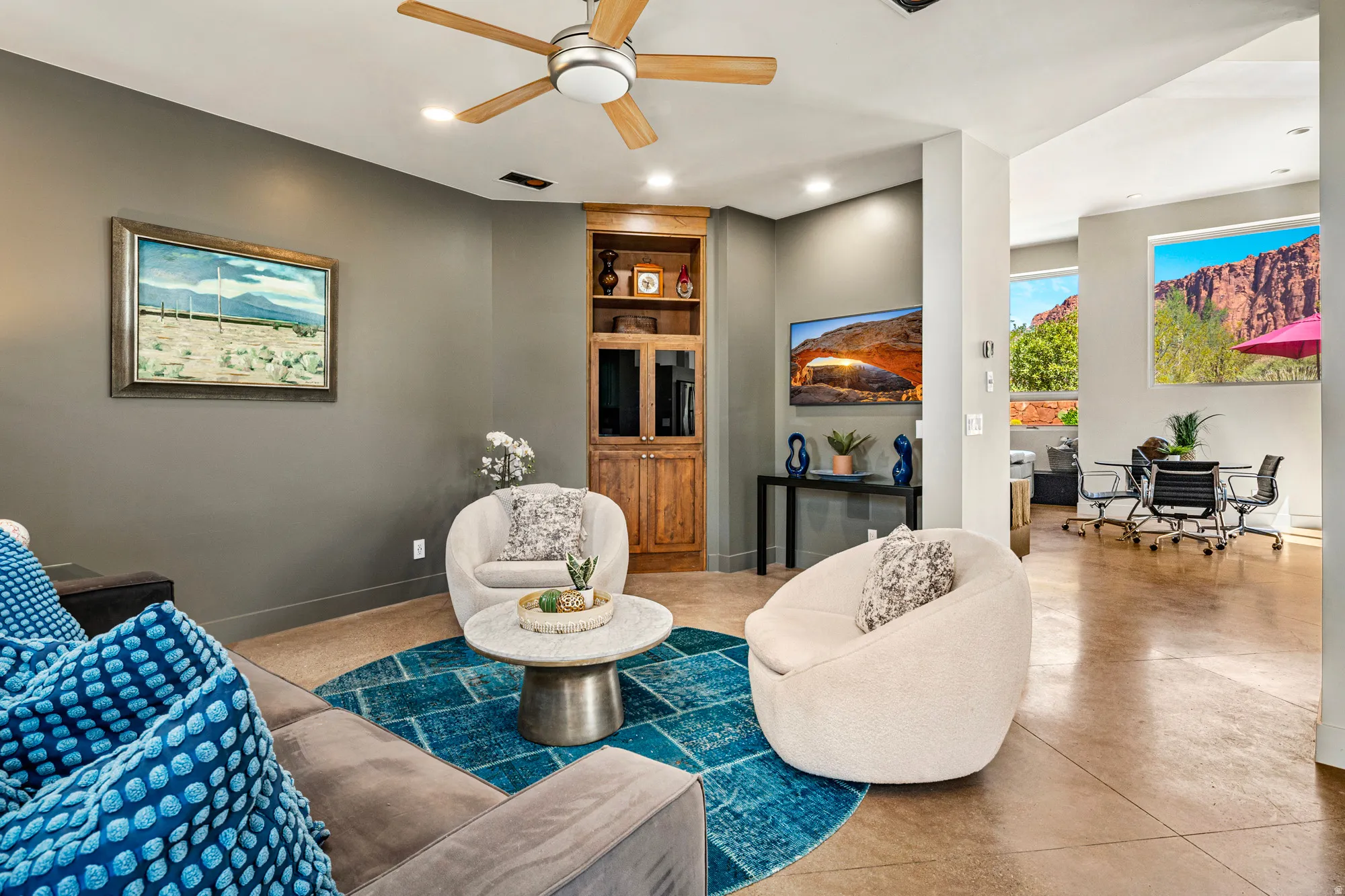 Open-concept living area with high ceilings and recessed lighting