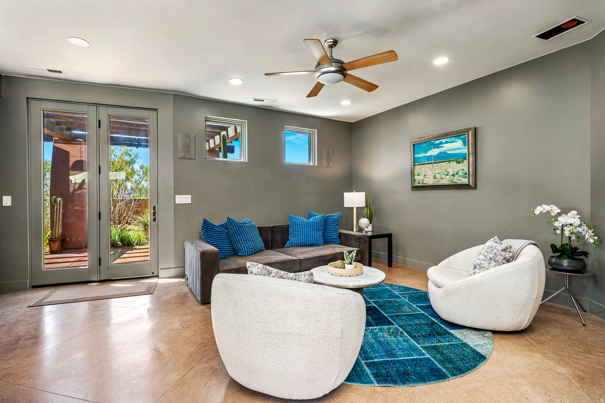 Living area featuring light-colored flooring, recessed lighting, and a ceiling fan