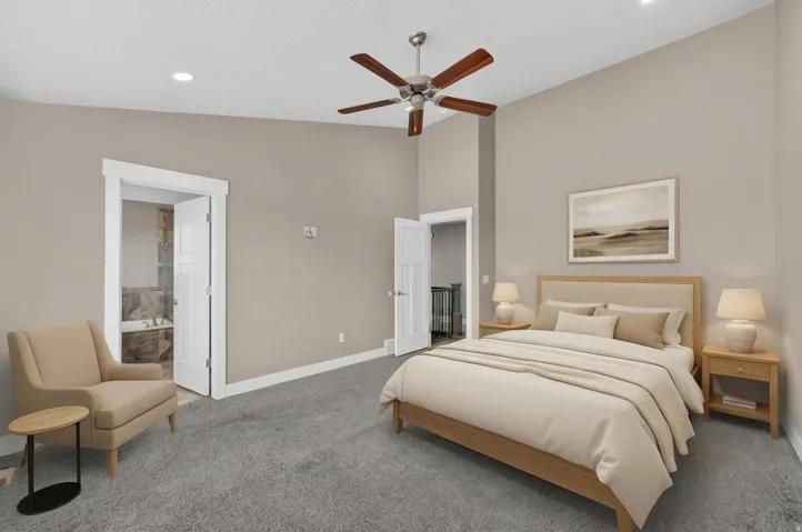 Spacious bedroom featuring vaulted ceilings, recessed lighting, and a ceiling fan