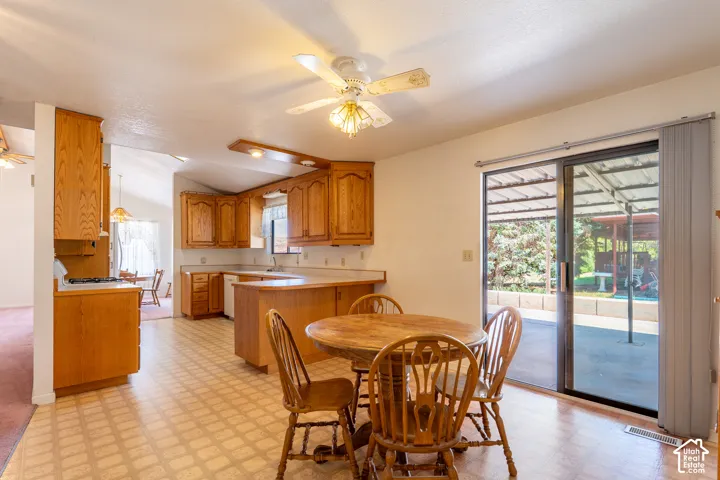 Functional kitchen featuring wood cabinetry, white countertops, and integrated appliances