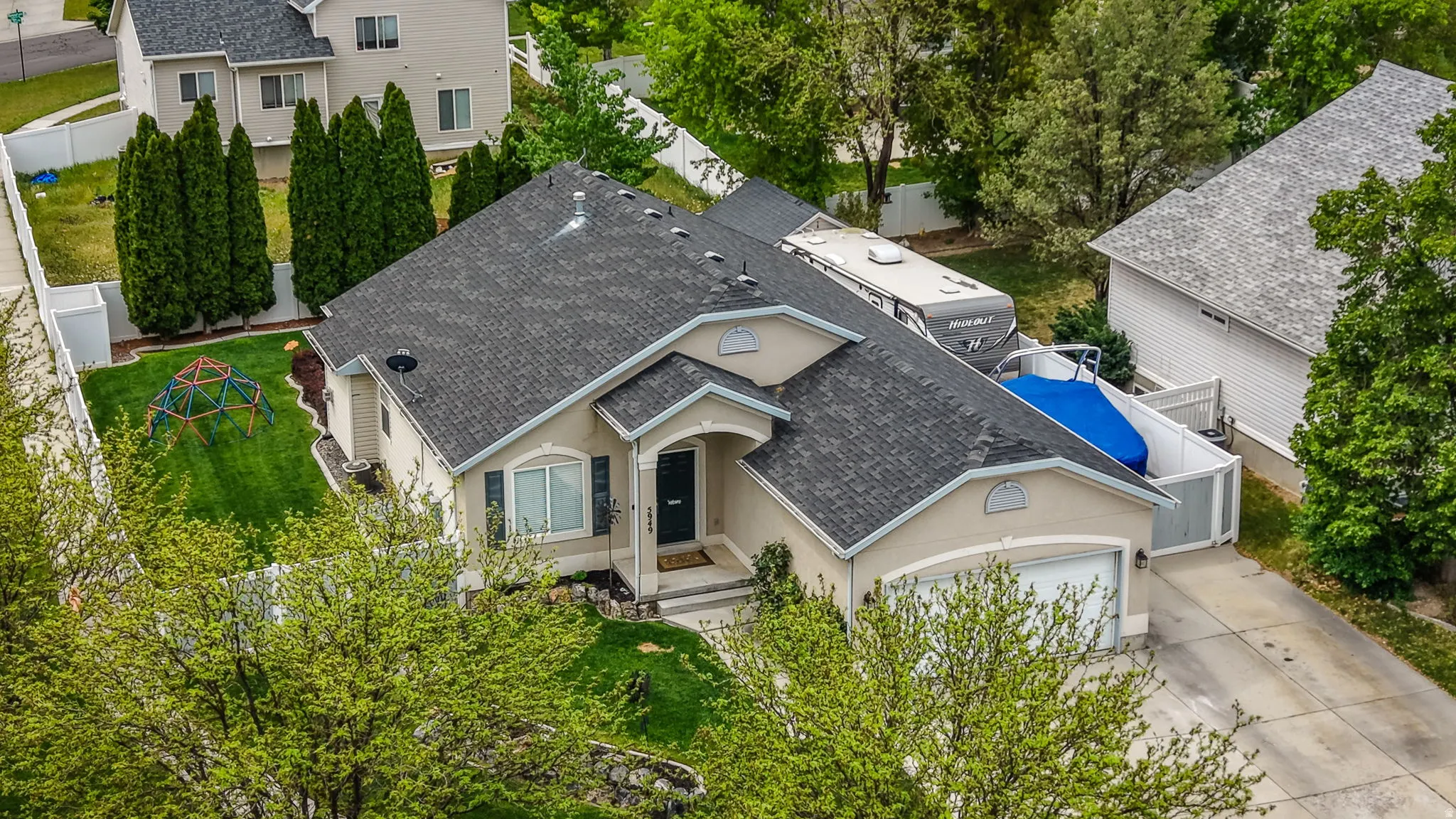 Single-story stucco residence with an attached two-car garage