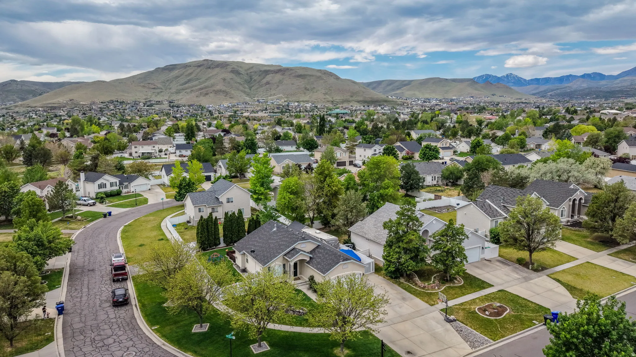 Aerial perspective showcasing a residential community with mature landscaping