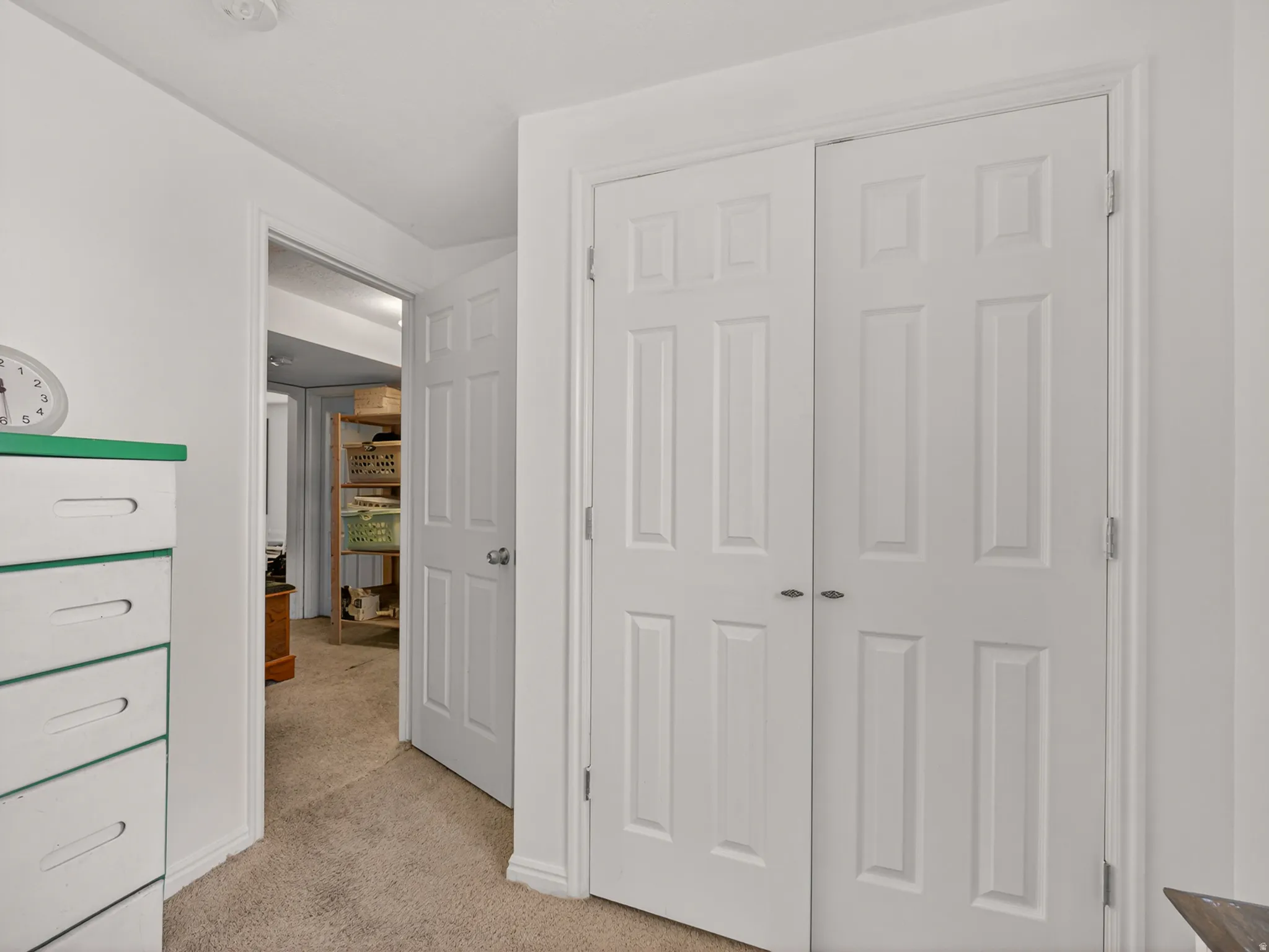Basement bedroom with view of hallway
