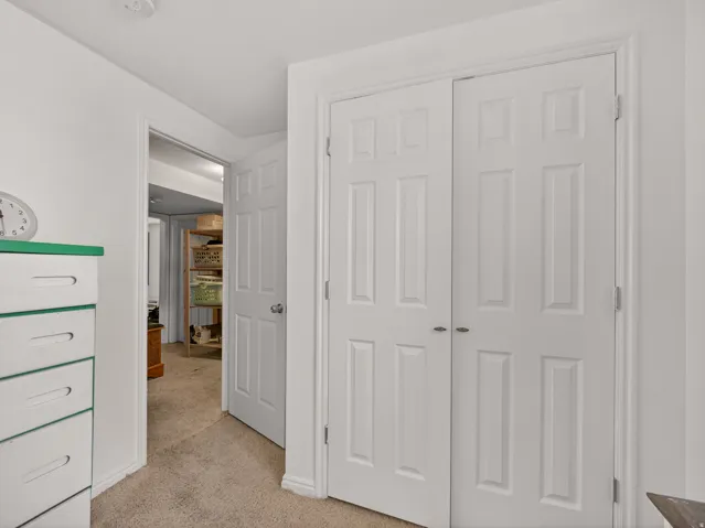 Basement bedroom with view of hallway