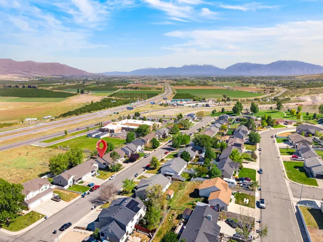 Suburban neighborhood featuring a network of paved roads and residential properties