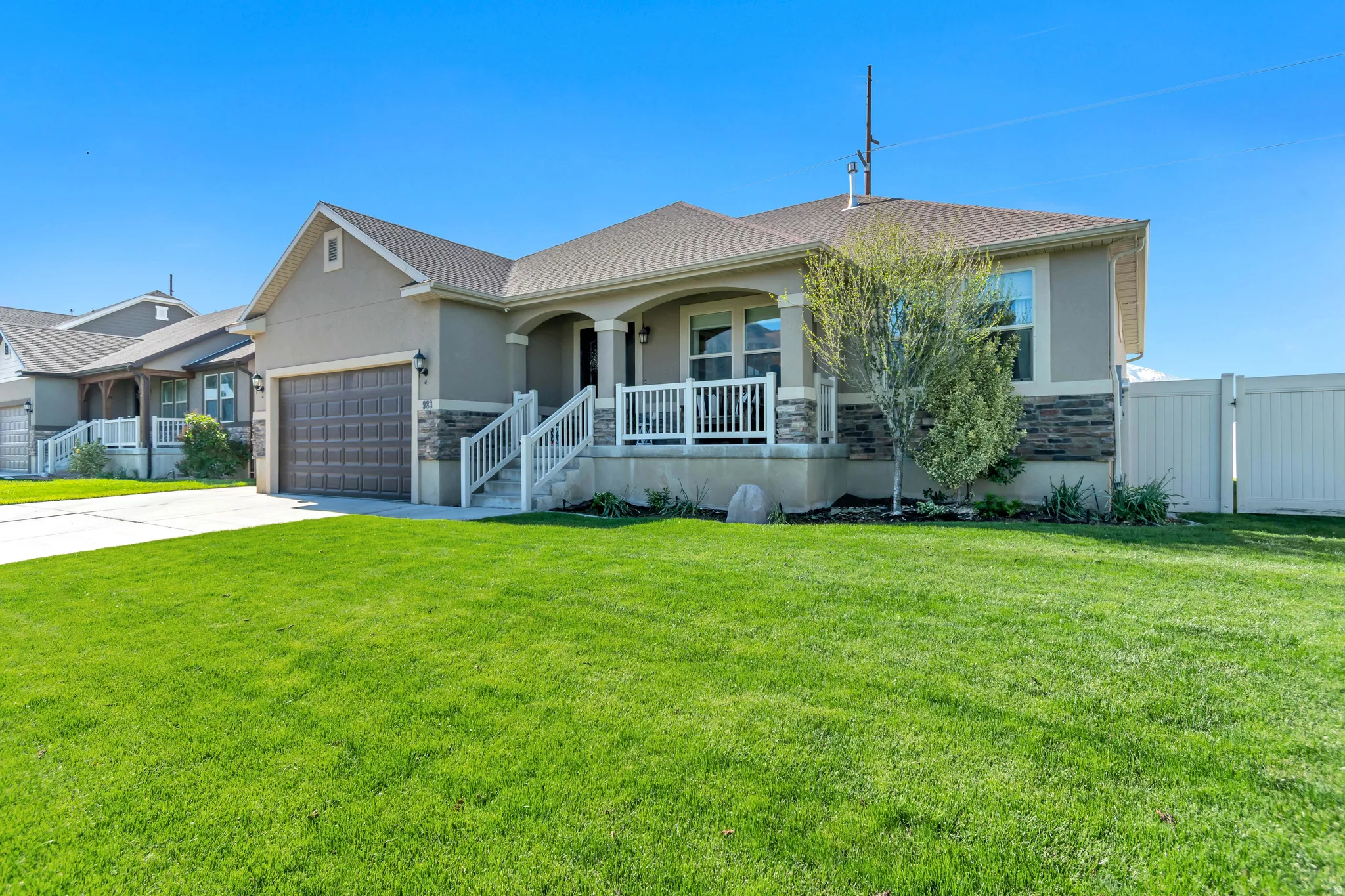 Stucco exterior with stone accent siding.