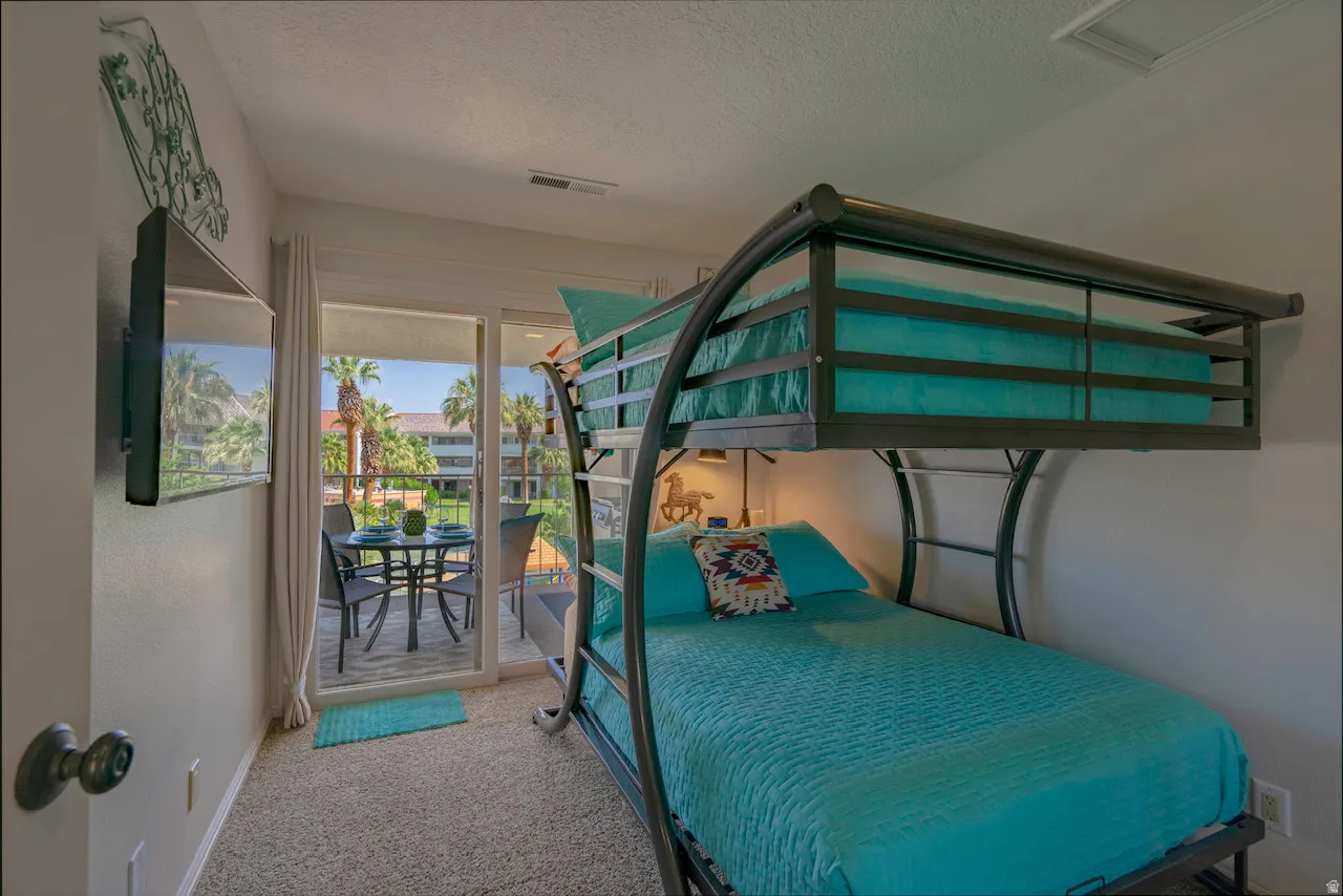 Sliding glass doors opening to a private balcony