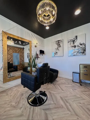 Herringbone wood-finish flooring complements a dark ceiling and white paneled walls