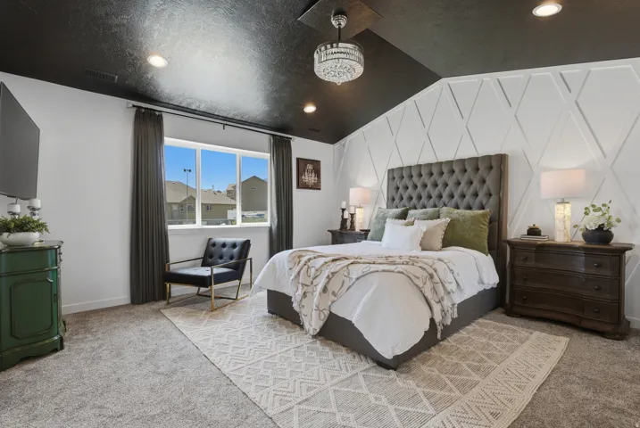 Accent wall with geometric trim, featuring a tufted headboard