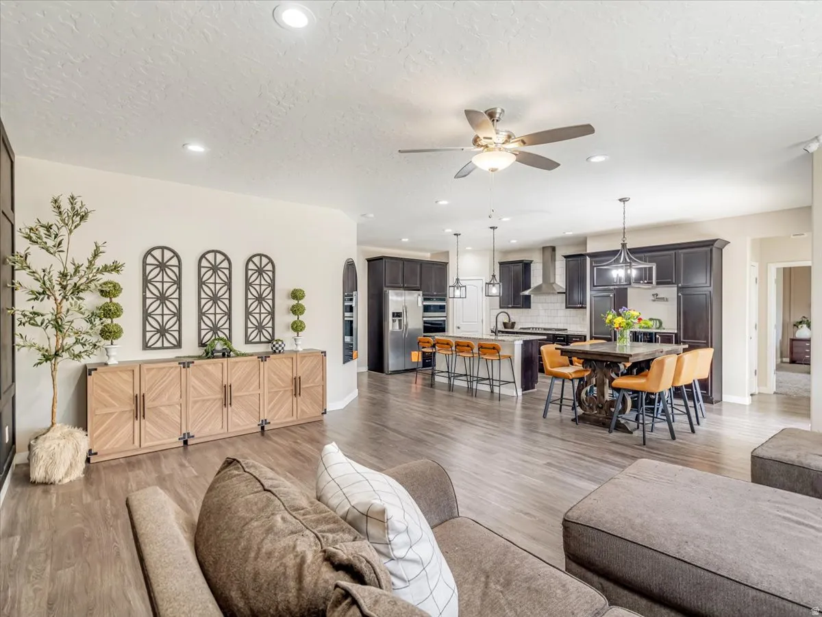 Open-concept common area featuring wood-finish flooring throughout