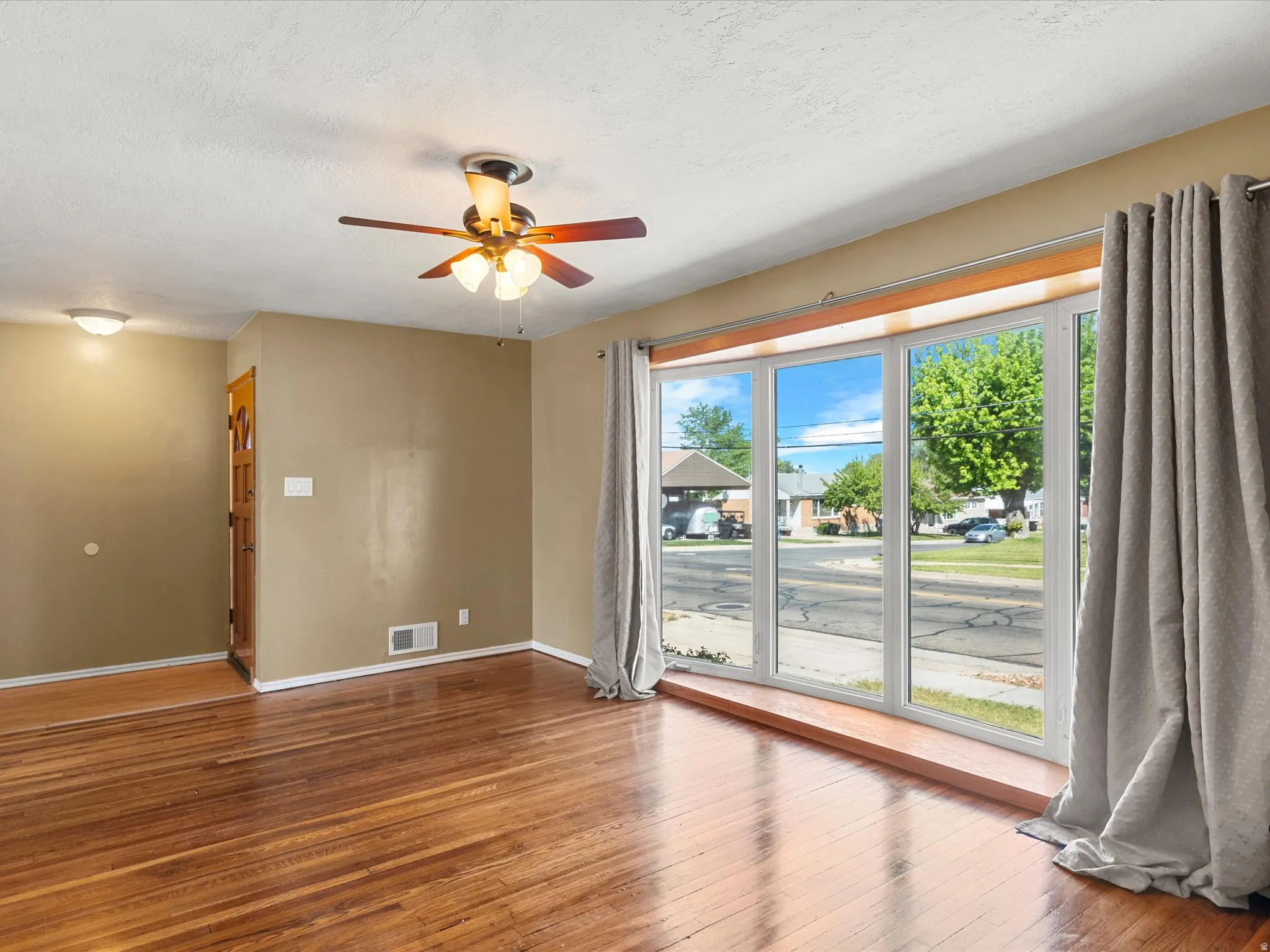 Expansive bay window featuring multiple panes and a deep sill