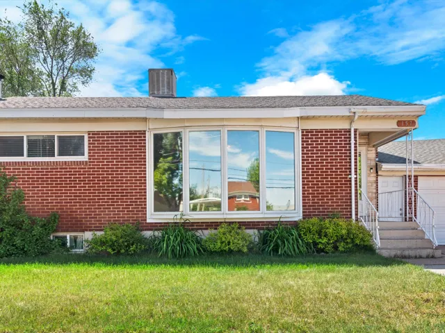 Red brick exterior with a prominent multi-pane bay window