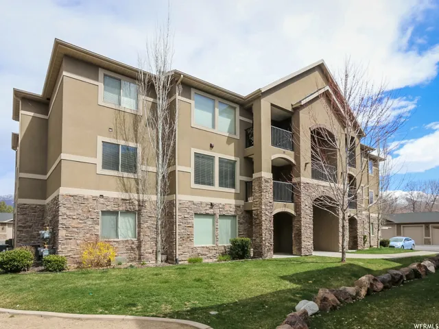 Multi-story building with a stucco and stone veneer exterior