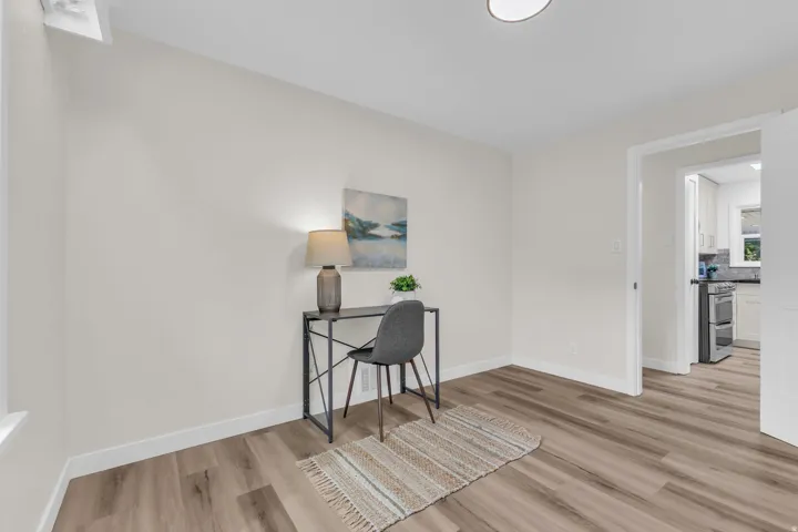 Bright room with light-toned walls and wood-finish flooring