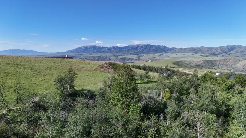 Expansive mountain scenery with distant snow-capped peaks