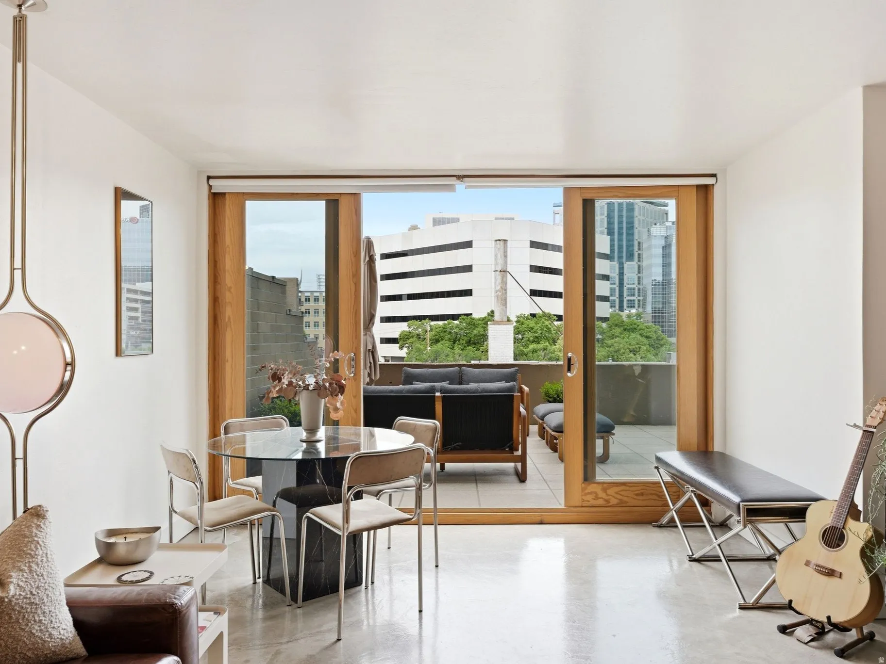 Sliding glass doors provide access to a private outdoor patio