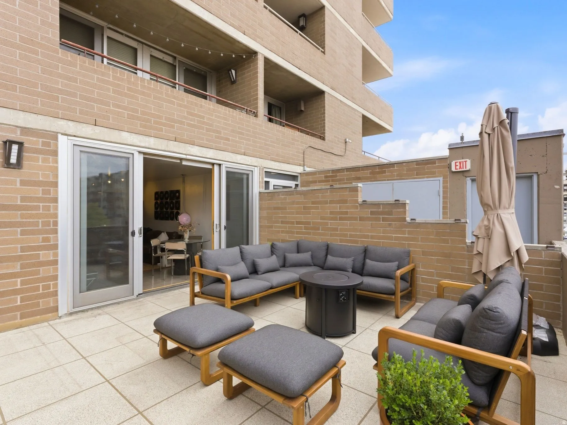 Expansive outdoor patio featuring light-colored tile flooring