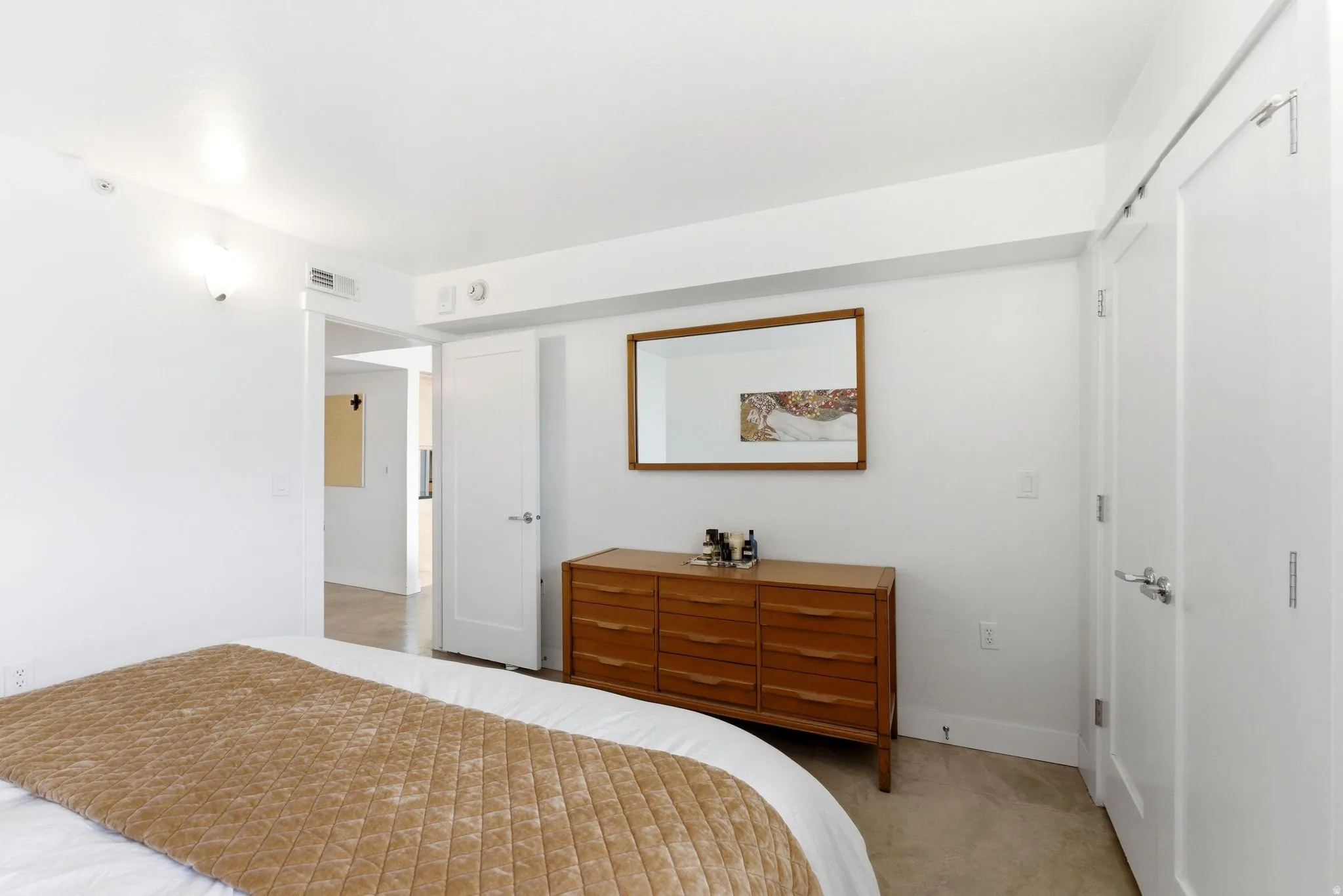Bright interior room with light-colored flooring and white walls