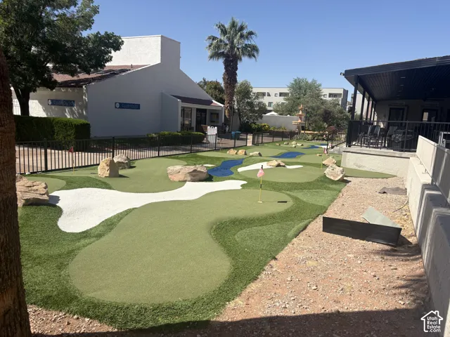 Outdoor putting green with multiple holes and bunkers
