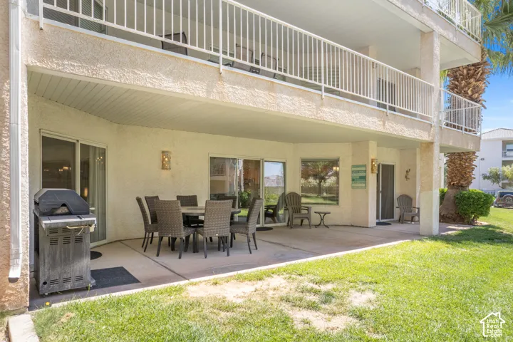 Ground-level patio featuring a concrete surface and direct lawn access