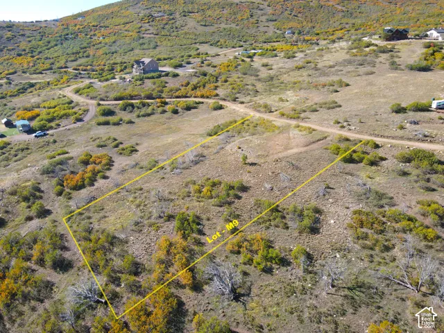 Expansive undeveloped land featuring natural terrain and sparse vegetation
