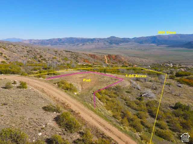 1.04-acre parcel featuring a prepared pad and expansive mountain scenery