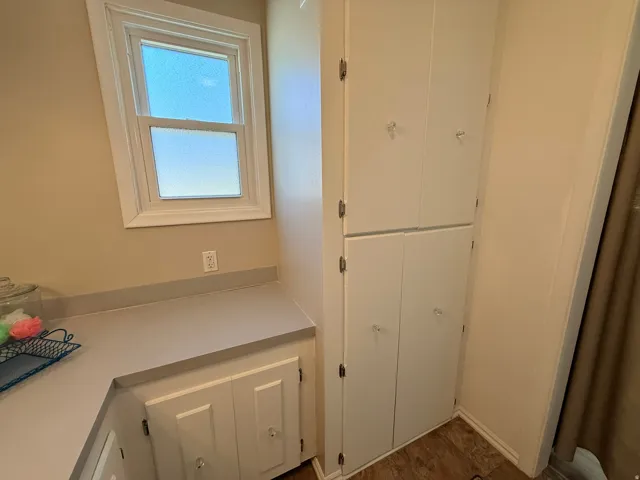White built-in cabinetry with crystal-style knobs