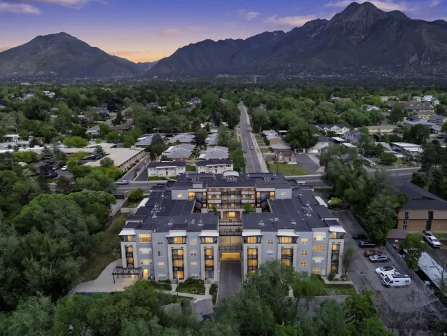 Modern residential building featuring multi-level architecture and integrated balconies
