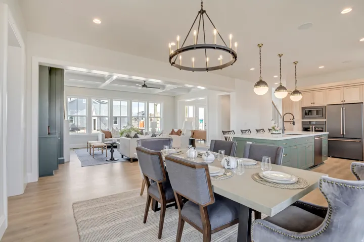 Open-concept living space featuring wood-finish flooring, recessed lighting, and a coffered ceiling