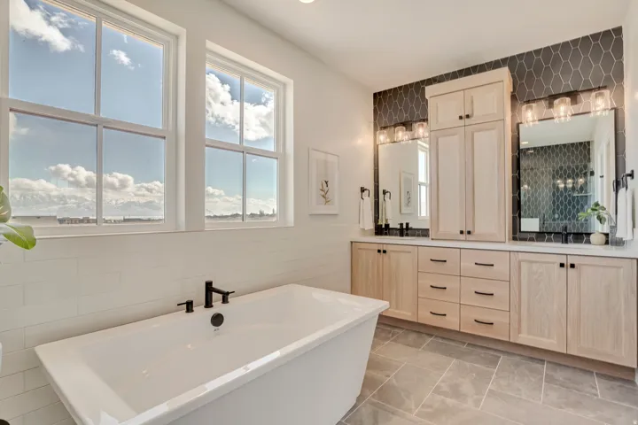 Freestanding soaking tub with matte black fixtures