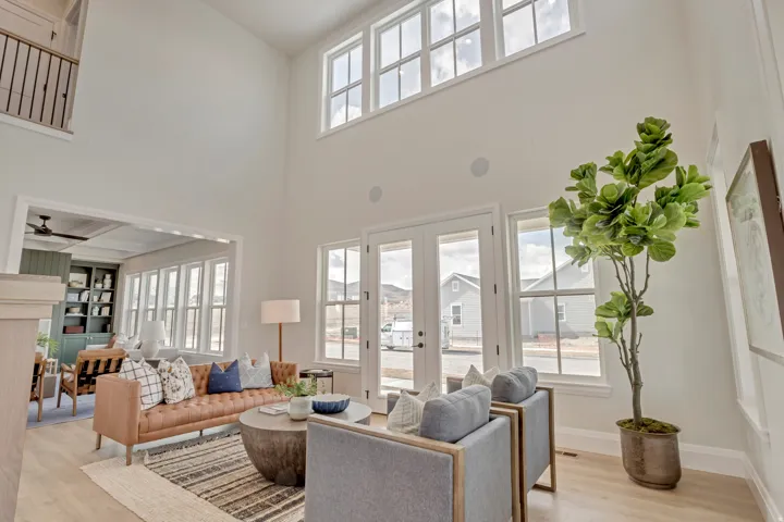 Two-story living area with high ceilings and abundant natural light