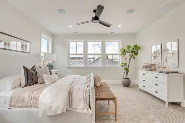 Spacious room with a ceiling fan, recessed lighting, and white walls