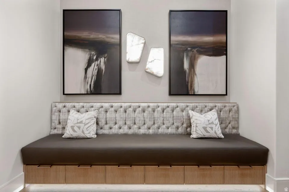 Built-in bench seating with tufted upholstery and under-bench storage drawers