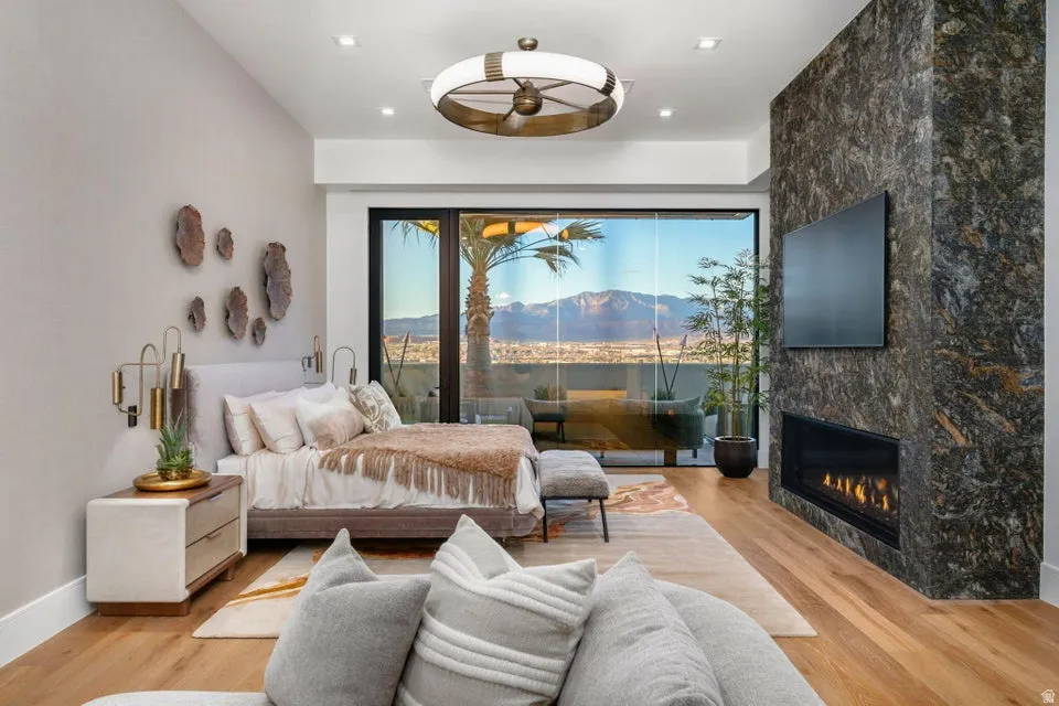 Expansive floor-to-ceiling sliding glass doors open to an outdoor space