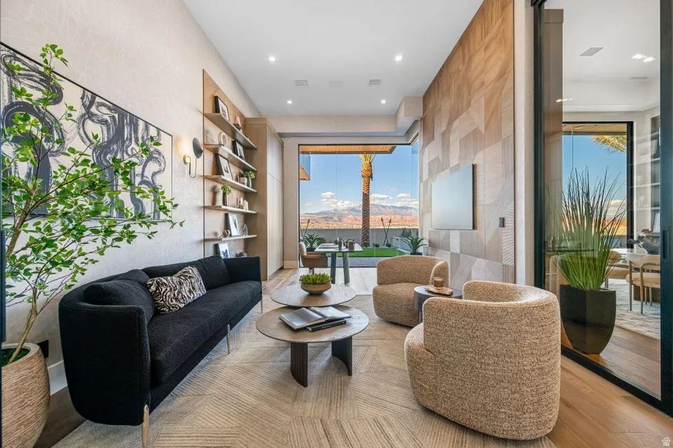 Open-concept living space with expansive floor-to-ceiling glass paneling