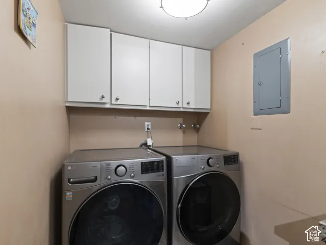 Dedicated laundry space featuring upper cabinetry storage