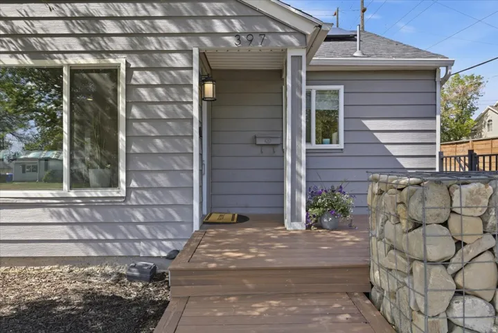 Gray horizontal siding exterior with white window trim