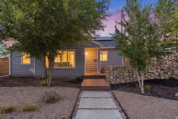 Exterior featuring horizontal siding, a covered entry, and a wood-finish porch