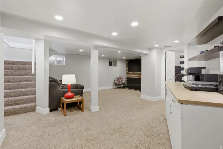 Spacious lower level featuring recessed lighting and neutral-toned carpet flooring