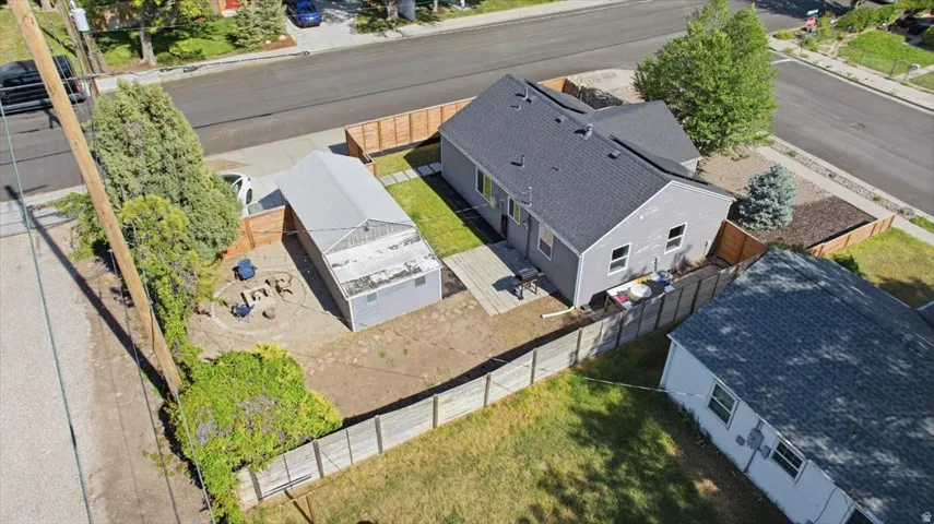 Aerial perspective showcasing the property's exterior and fenced yard