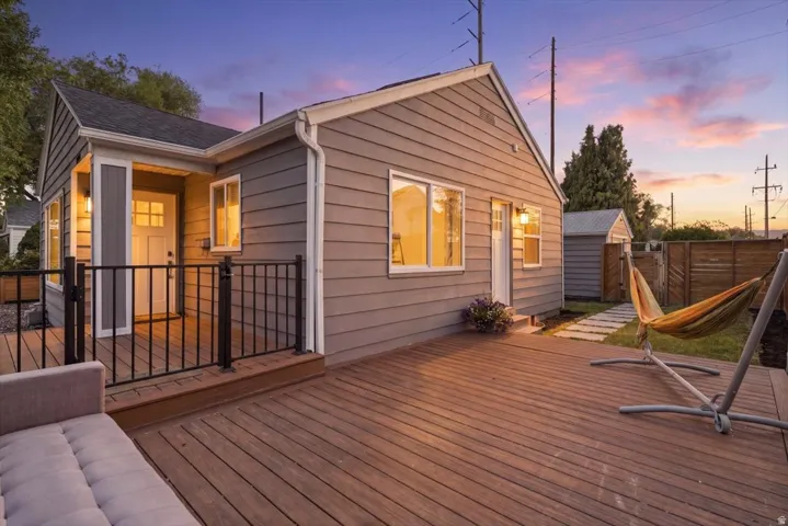 Expansive wood-finish deck with black metal railings