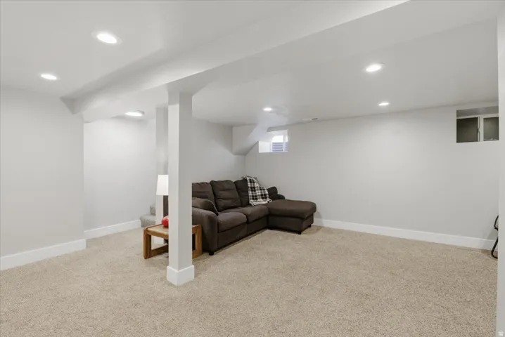 Spacious carpeted room featuring recessed lighting, painted walls, and white trim